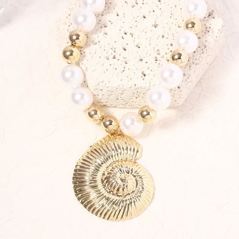 Gold Conch Necklace