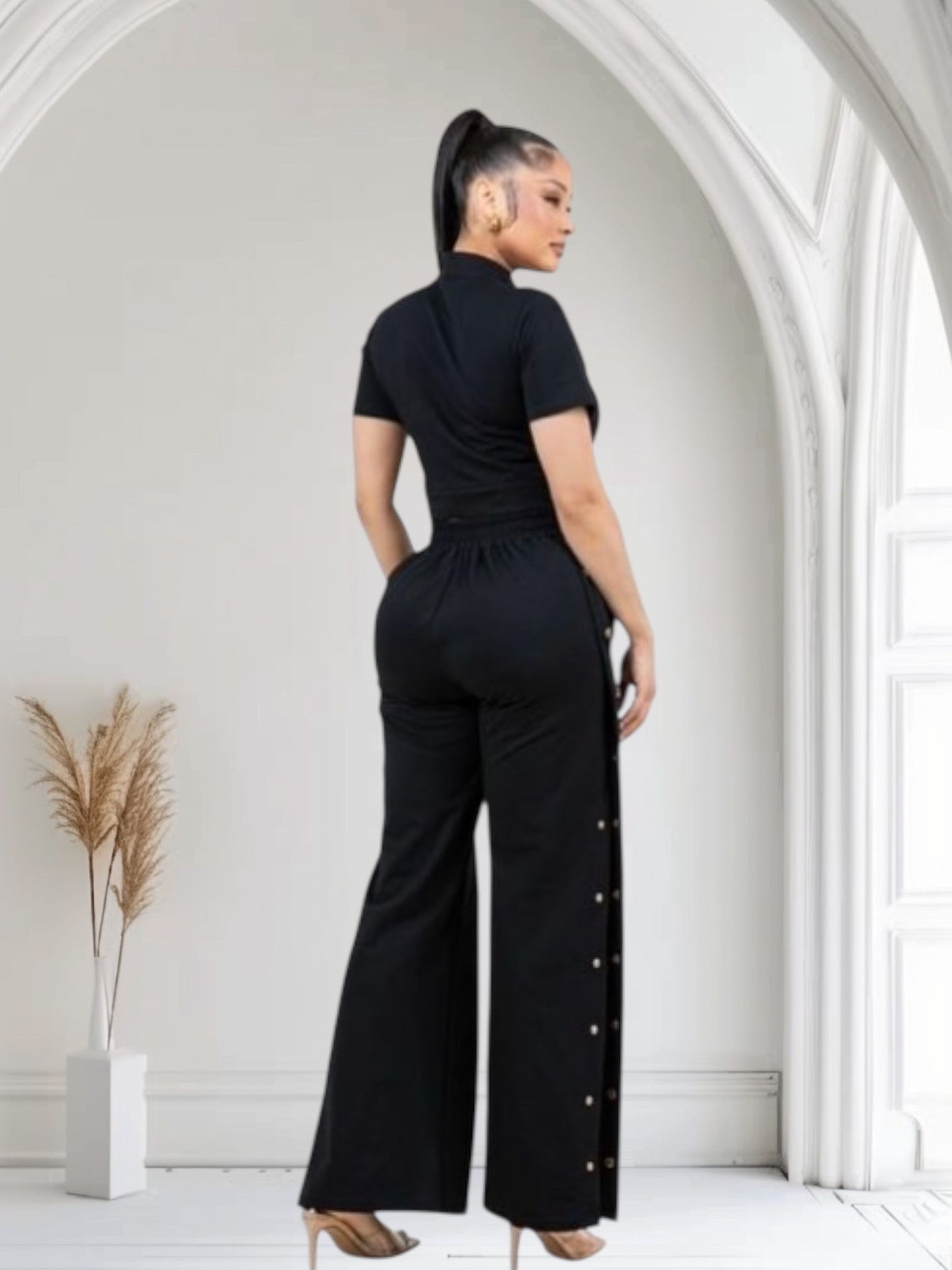 Sleek Crop Top Paired With High-Waist Black Pants With Gold Buttons
