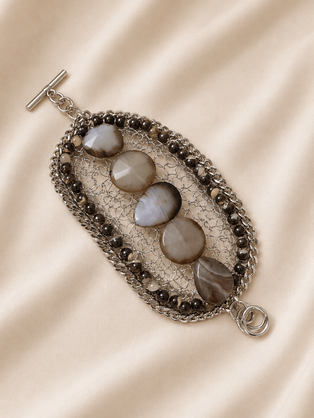 Woven bracelet with gray stones